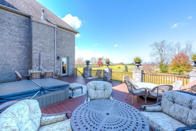 deck featuring a hot tub