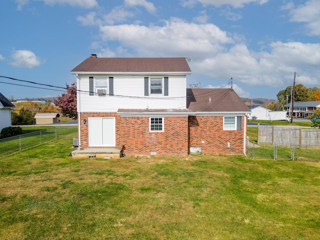 back of house with a yard