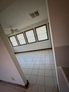 unfurnished bedroom featuring ceiling fan