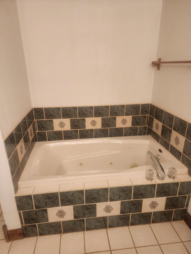 bathroom featuring vanity, a shower, and tile patterned flooring