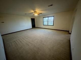 empty room featuring light carpet