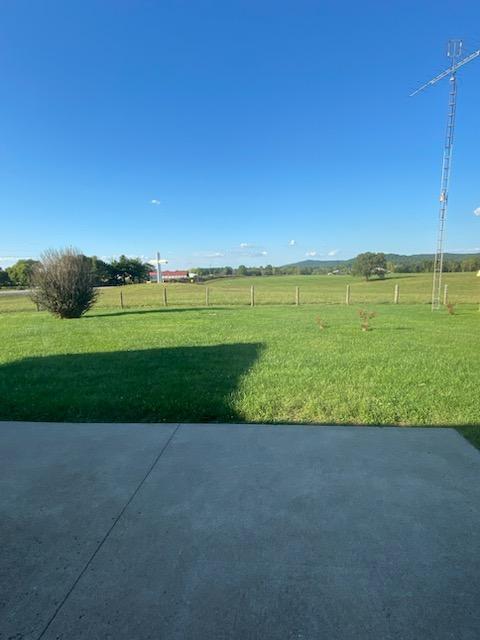 view of yard with a rural view