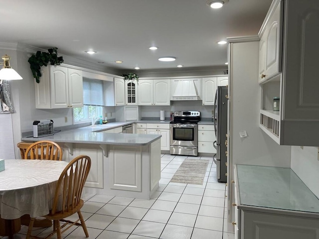 kitchen with light tile patterned floors, a peninsula, a breakfast bar, appliances with stainless steel finishes, and custom exhaust hood