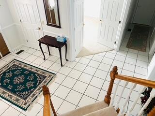 hall featuring tile patterned flooring