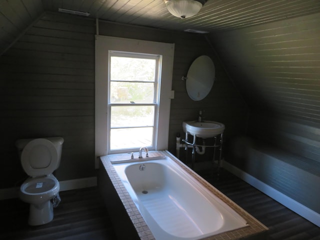 10 W Church St, Stanton, KY 40380 - bathroom featuring lofted ceiling, wood finished floors, a garden tub, plenty of natural light, and wooden walls