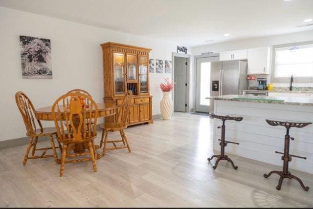 dining room with light wood-type flooring