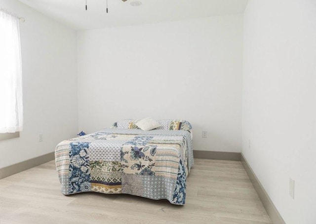 bedroom featuring light wood-type flooring