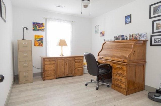 office area with light wood-type flooring and ceiling fan