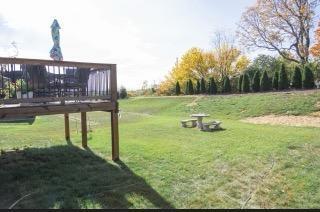 view of yard with a wooden deck