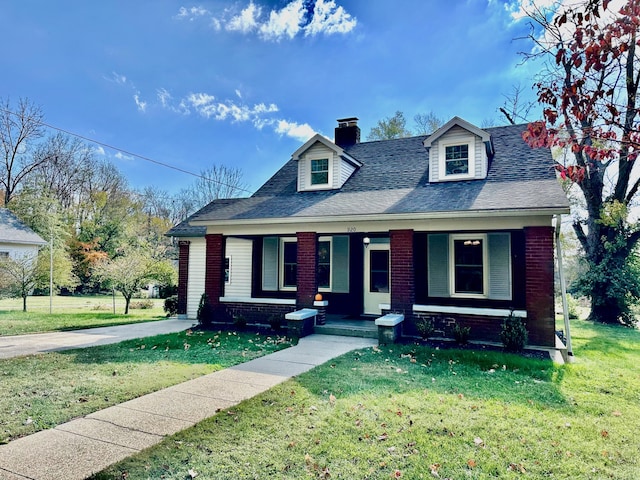 cape cod home with a front yard and a porch