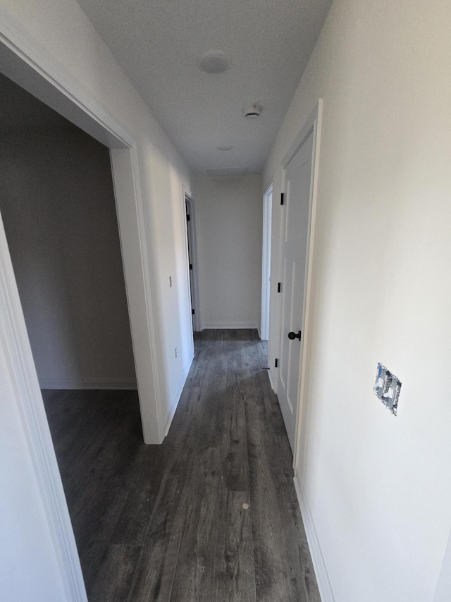 hall with dark hardwood / wood-style floors