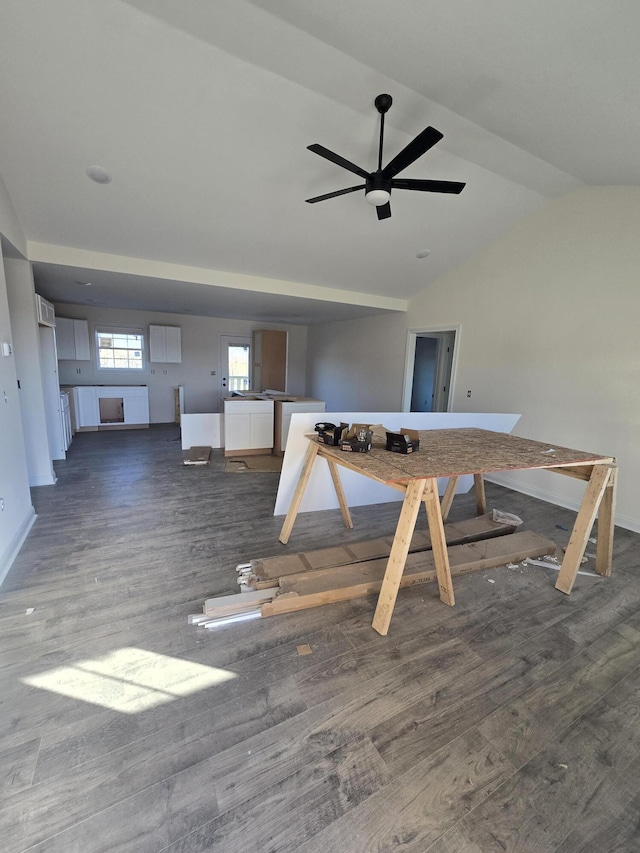 unfurnished dining area with dark wood-type flooring, ceiling fan, and vaulted ceiling