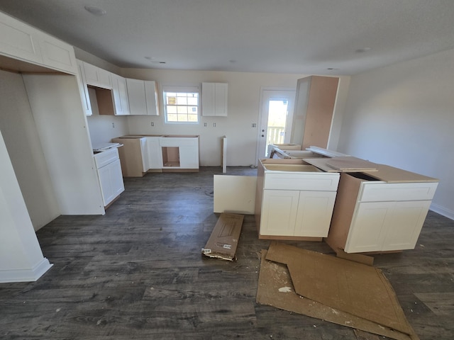 kitchen with white cabinetry and dark wood-type flooring