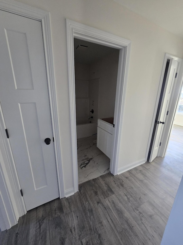 corridor featuring hardwood / wood-style flooring