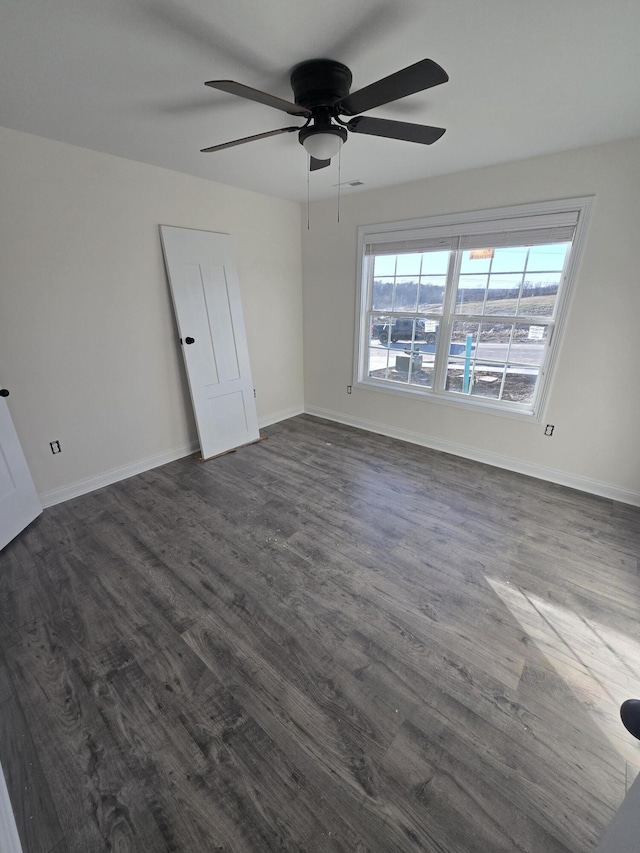 empty room featuring dark wood-type flooring