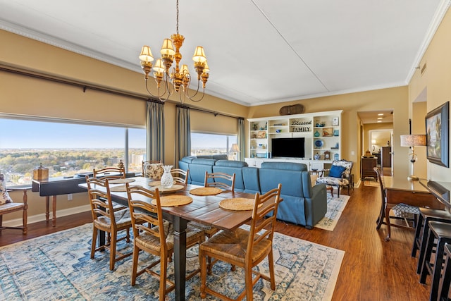 dining room featuring an inviting chandelier, ornamental molding, and hardwood / wood-style flooring