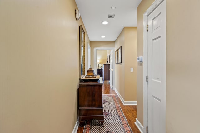 hall with dark hardwood / wood-style flooring