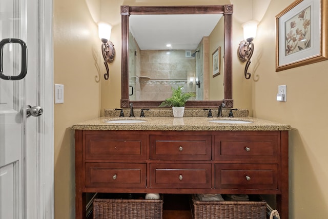 bathroom featuring vanity and an enclosed shower