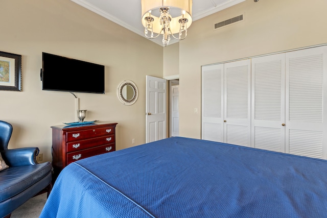 carpeted bedroom featuring a chandelier, a closet, and crown molding