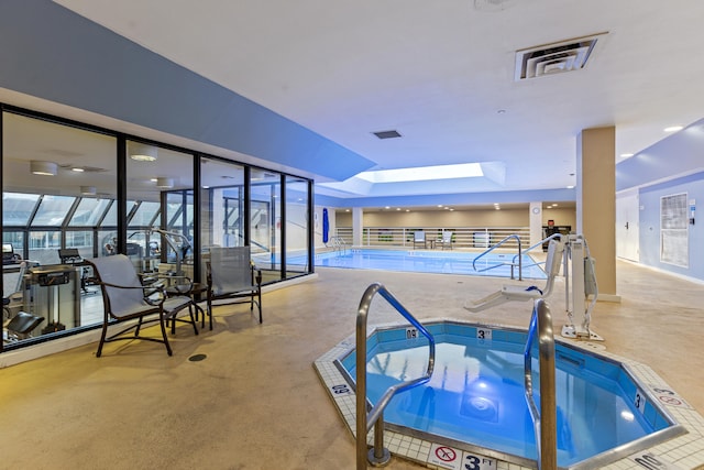 view of pool with a skylight