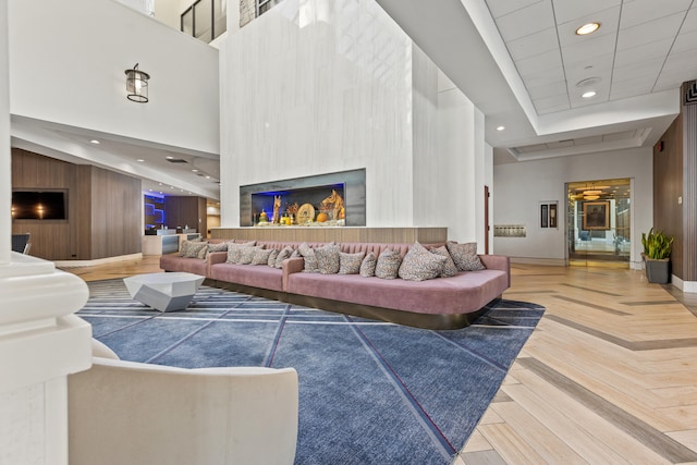 living room with a high ceiling and parquet flooring