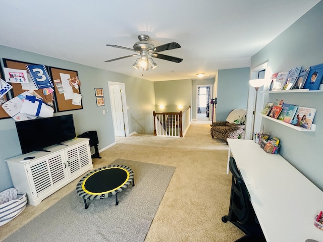 carpeted living room with ceiling fan