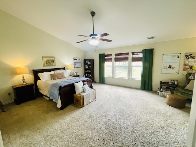 carpeted bedroom with lofted ceiling and ceiling fan