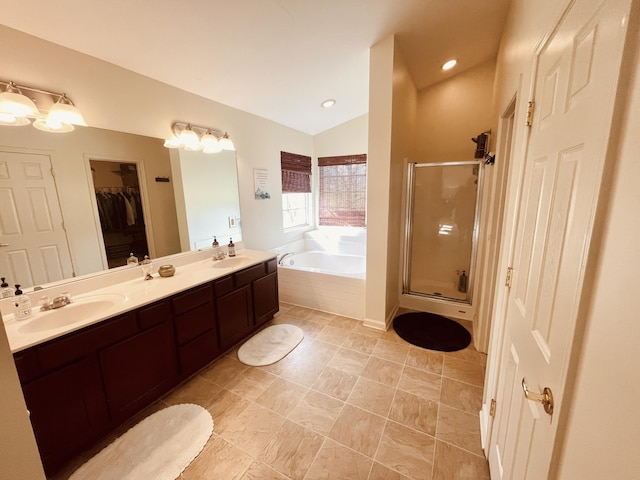 bathroom featuring vanity, lofted ceiling, and shower with separate bathtub