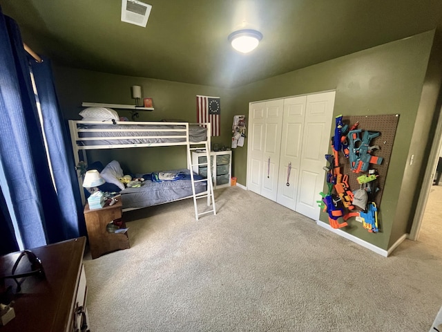 carpeted bedroom featuring a closet