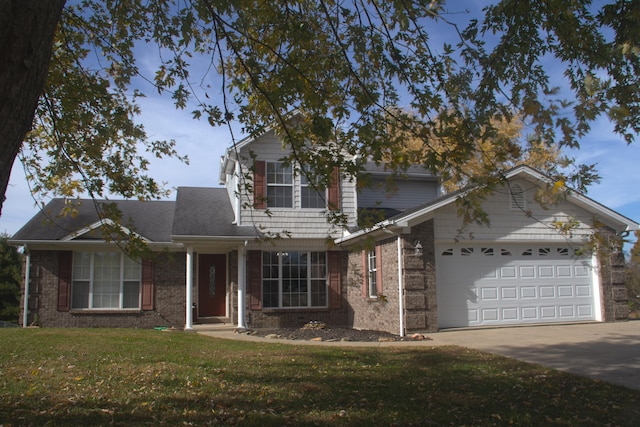 view of front property with a garage and a front lawn