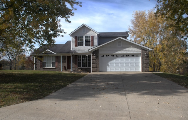 view of front facade featuring a front yard and a garage