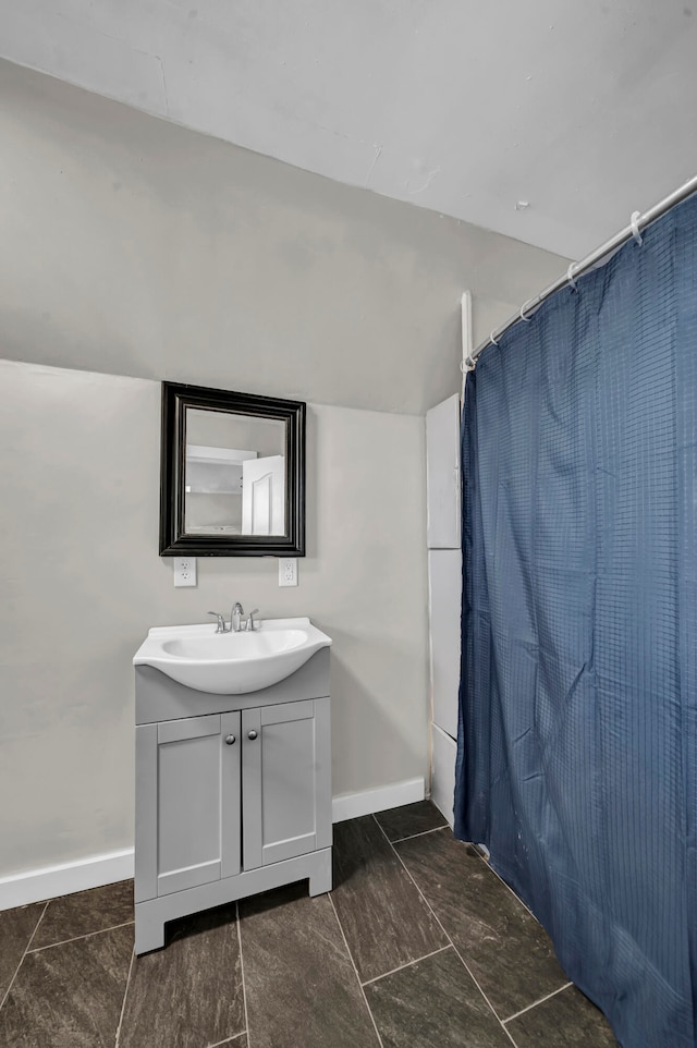 bathroom with vanity and walk in shower