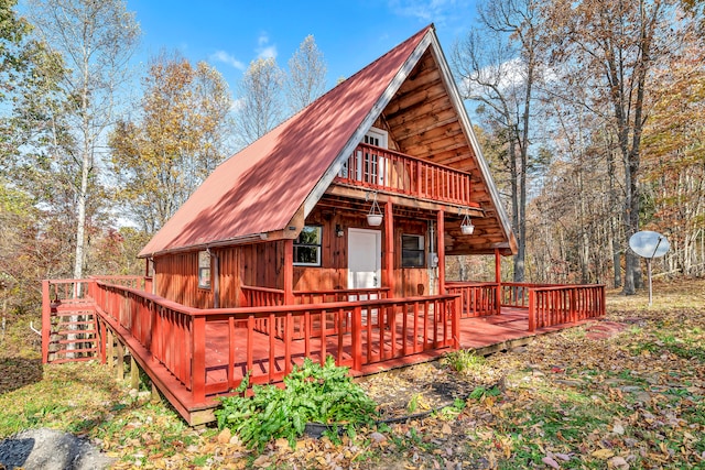 back of property with a wooden deck