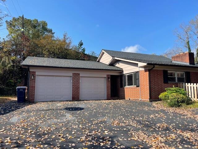 single story home with a garage