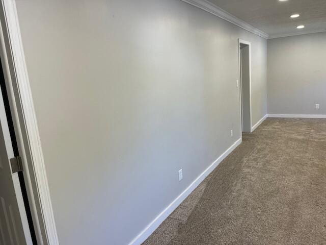 carpeted spare room with crown molding