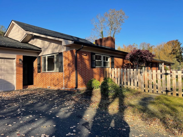 view of side of property featuring a garage