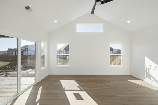 additional living space featuring dark hardwood / wood-style flooring, beamed ceiling, high vaulted ceiling, and ceiling fan