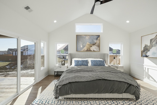 bedroom with hardwood / wood-style floors, high vaulted ceiling, beamed ceiling, access to exterior, and ceiling fan