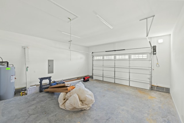 garage featuring electric panel and water heater