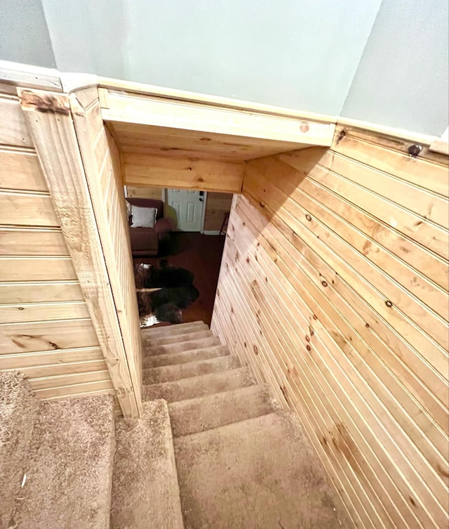 stairs featuring hardwood / wood-style flooring