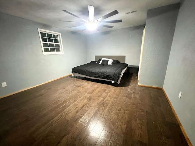 bedroom with wood-type flooring and ceiling fan