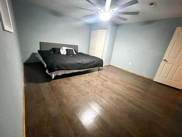 bedroom featuring dark wood-type flooring and ceiling fan