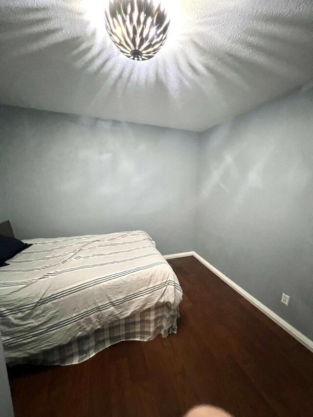 bedroom featuring wood-type flooring