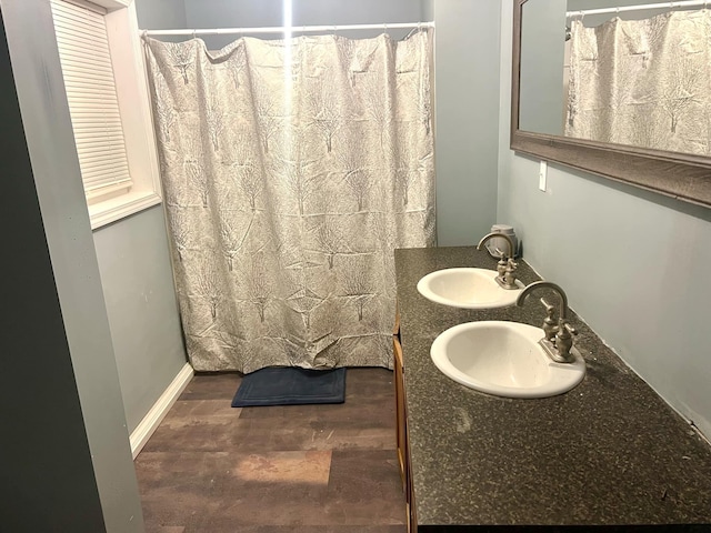 bathroom with vanity and curtained shower