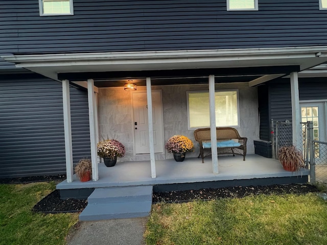 entrance to property featuring covered porch