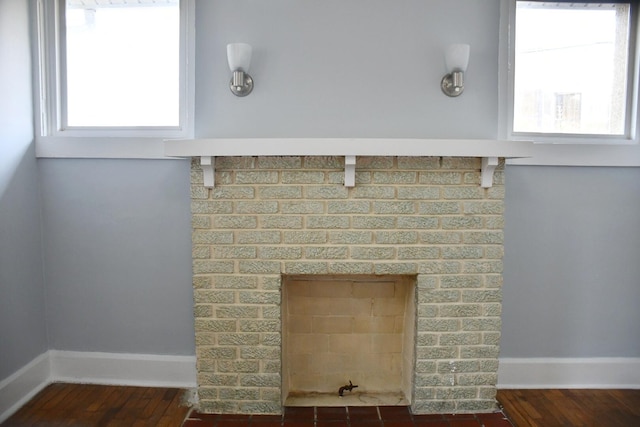 interior details with hardwood / wood-style floors and a fireplace