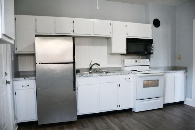 kitchen featuring sink, dark hardwood / wood-style flooring, electric range, stainless steel fridge, and white cabinets