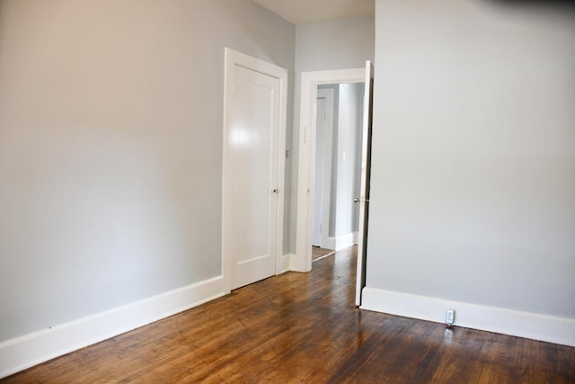 empty room featuring dark hardwood / wood-style floors