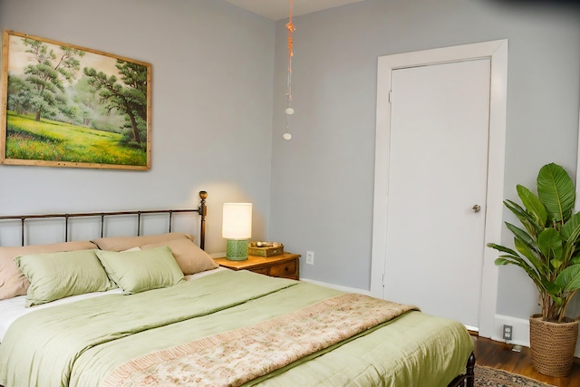 bedroom featuring wood-type flooring