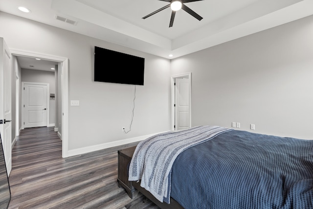 bedroom with ceiling fan and dark hardwood / wood-style floors